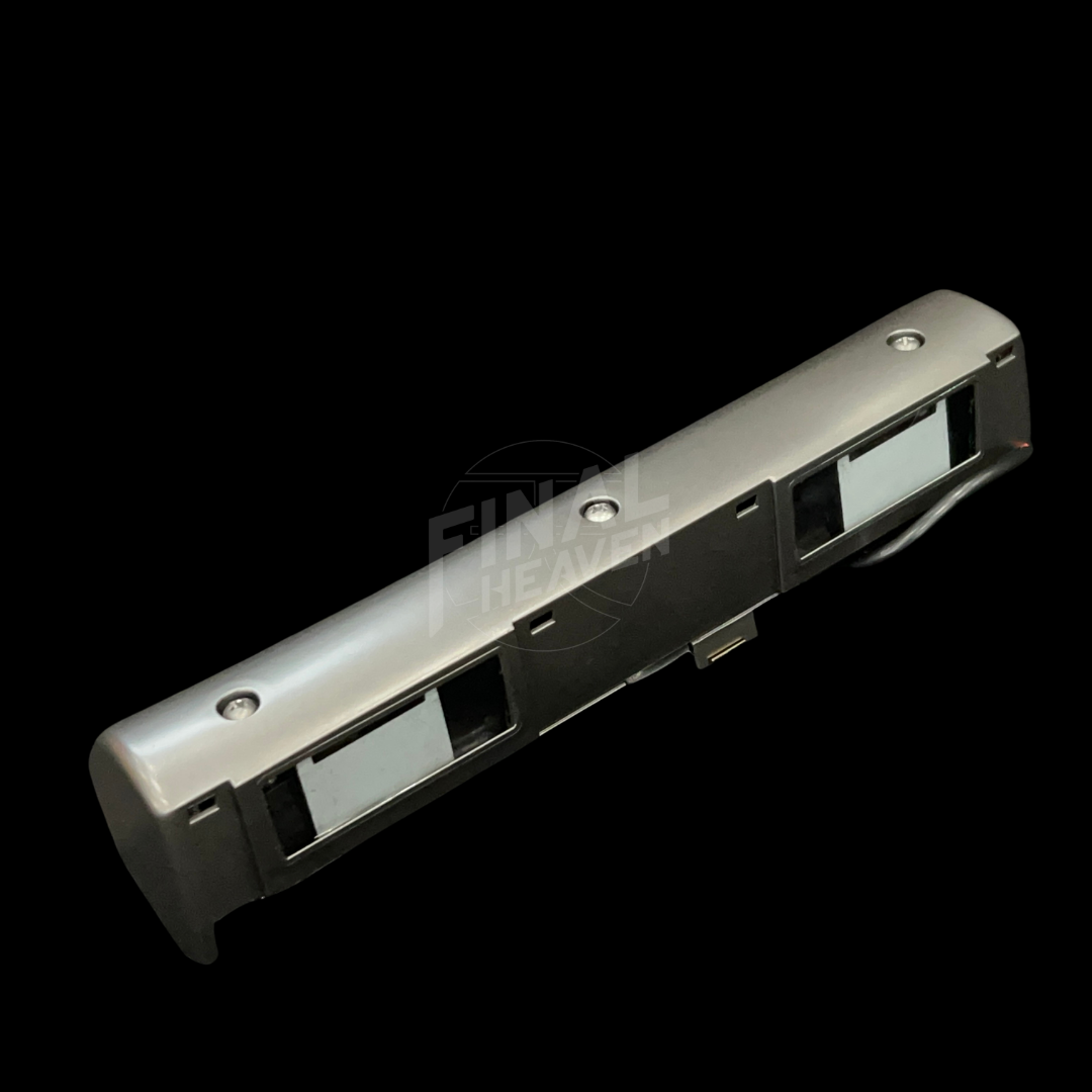 A grey license plate lamp for a Datsun 240Z