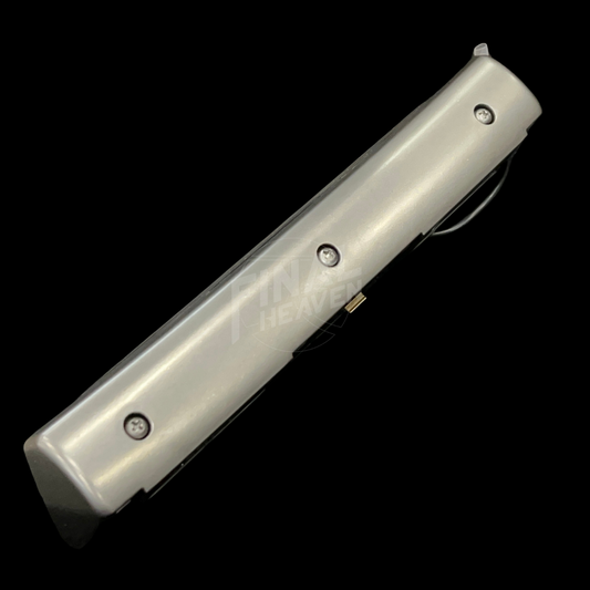 A grey license plate lamp for a Datsun 240Z