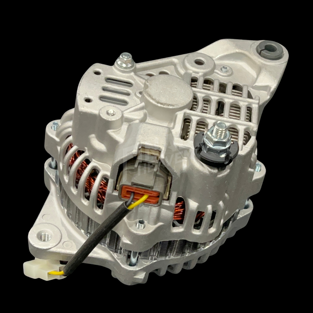 An 80A IC Alternator for vehicles such as 240Zs, Hakosukas, and 510s, featuring a metallic body with cooling fins, terminal connectors, and a fan.