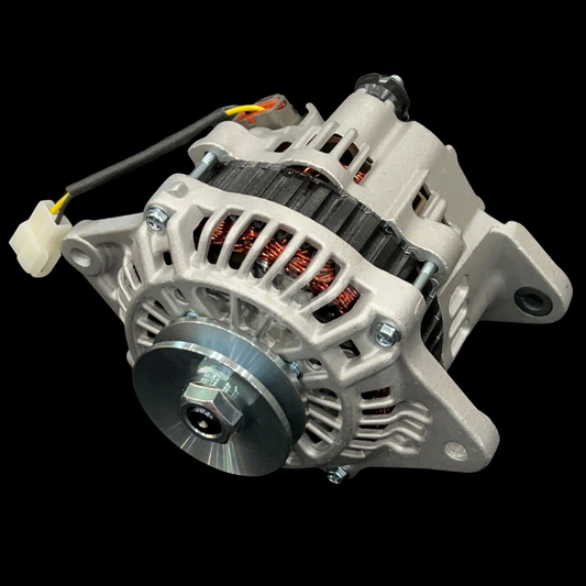 An 80A IC Alternator for vehicles such as 240Zs, Hakosukas, and 510s, featuring a metallic body with cooling fins, terminal connectors, and a fan.
