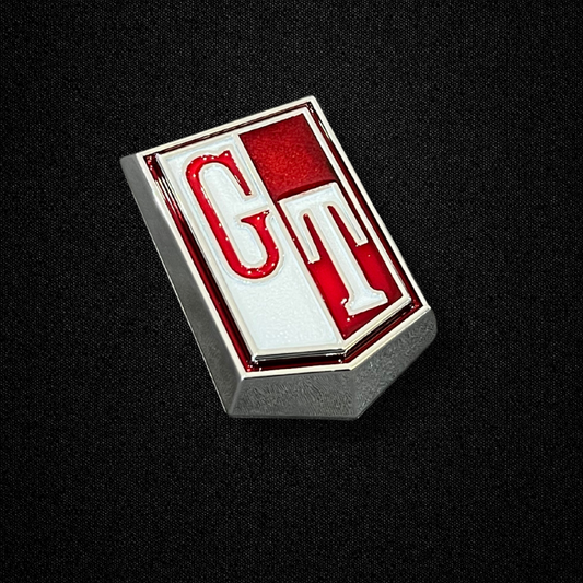 A red fender emblem for a KPGC10 Nissan Skyline 2000GT Hakosuka produced by MSpeed