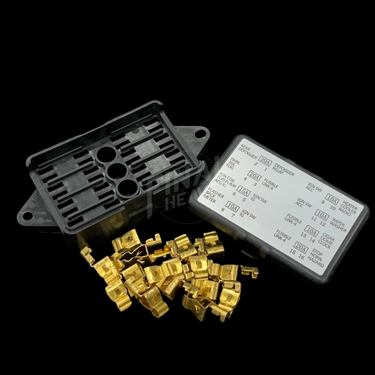 A set of fusebox repair kit components for a NIssan Hakosuka Skyline including a black plastic box, a cover, and gold-colored pins.