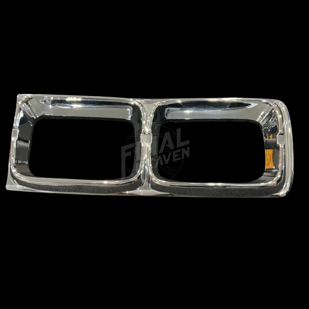 A pair of chrome Kouki Nissan Hakosuka Tail Light Trims KGC10