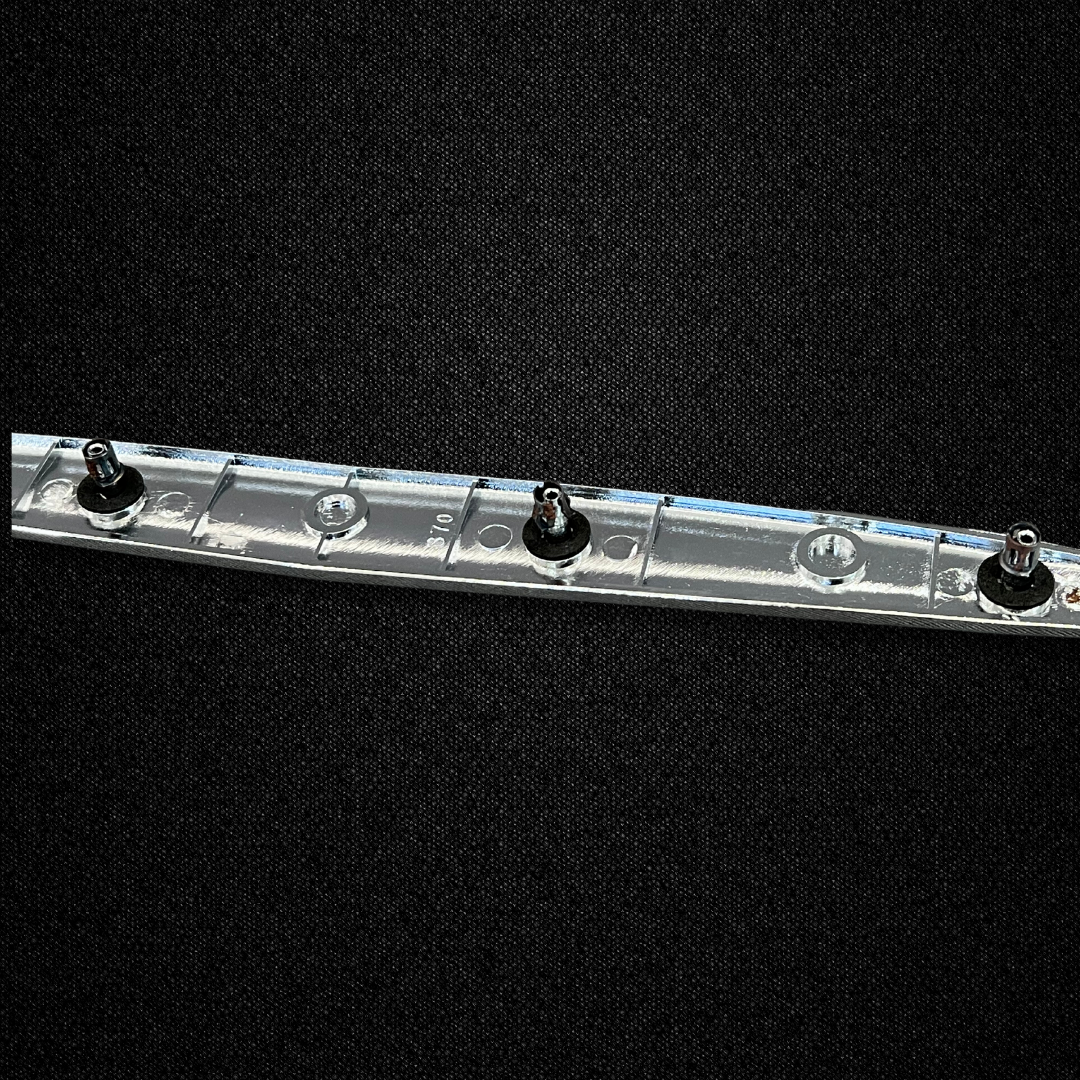 A red trunk emblem for a KPGC10 Nissan Skyline 2000GT Hakosuka produced by MSpeed