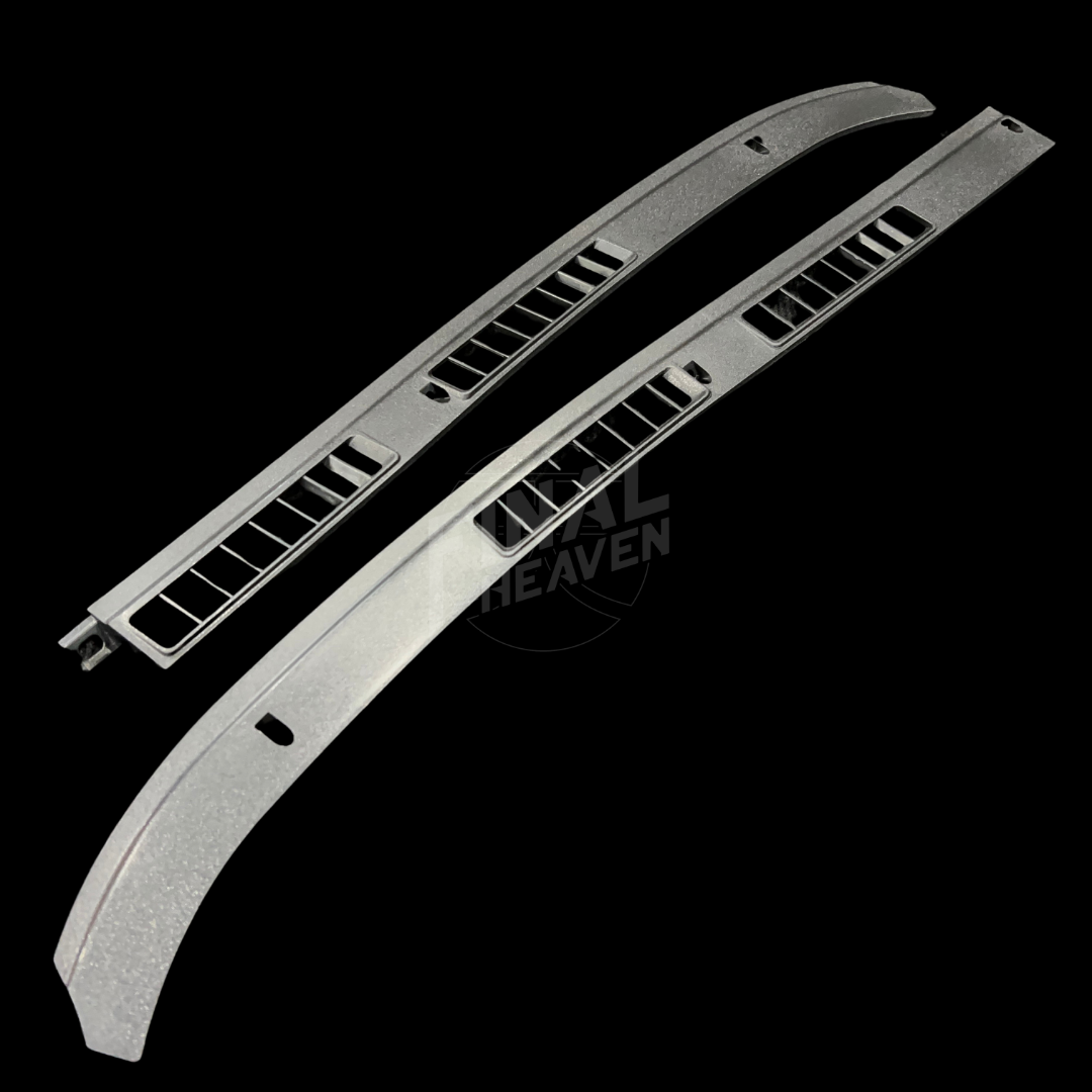 A set of two black dashboard vent covers for Nissan Hakosuka Zenki