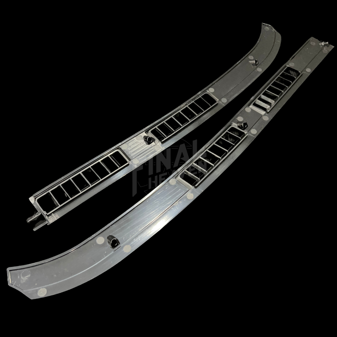 A set of two black dashboard vent covers for Nissan Hakosuka Zenki