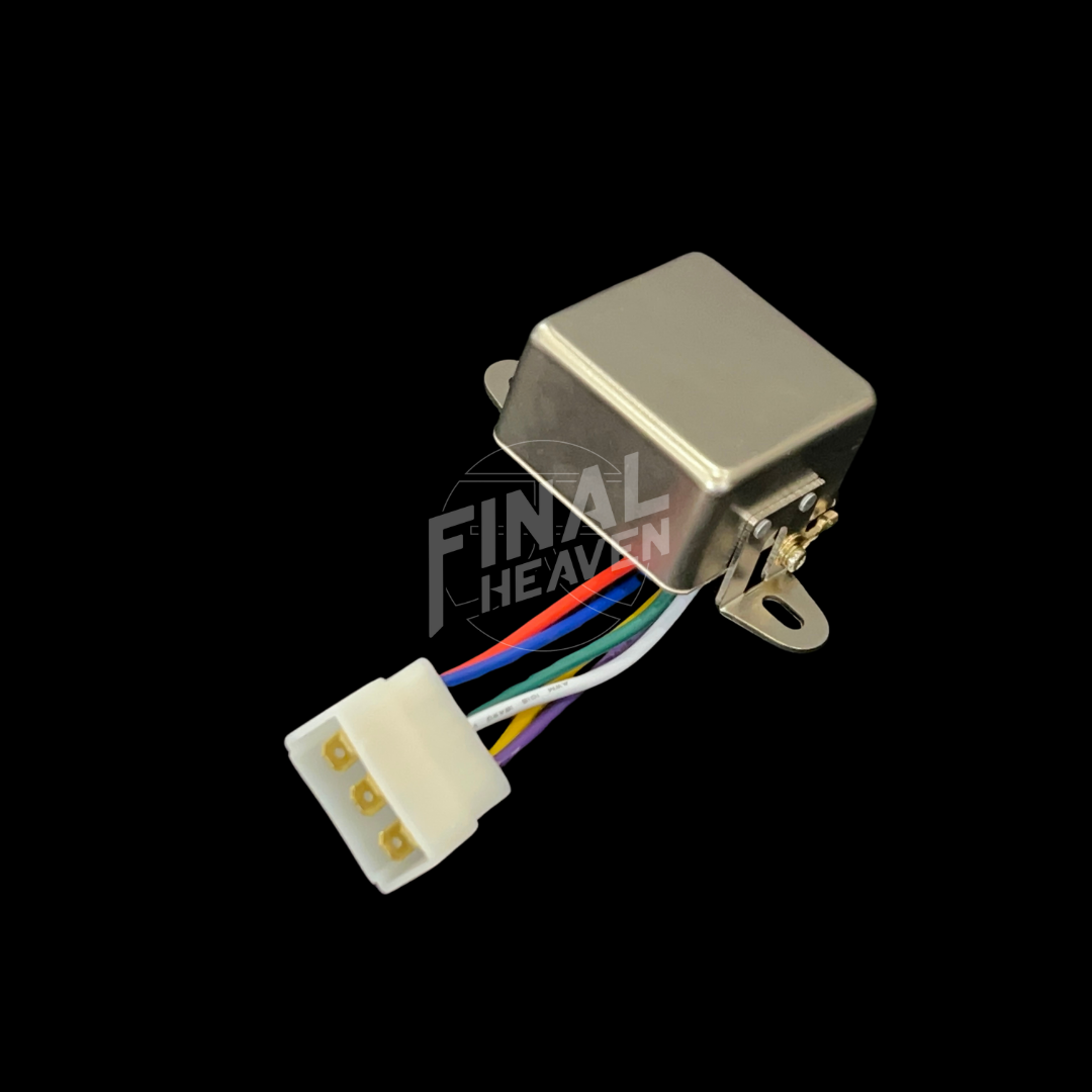 A silver headlight relay with a white connector and multicolored wires for a Nissan Skyline KGC10 or Hakosuka