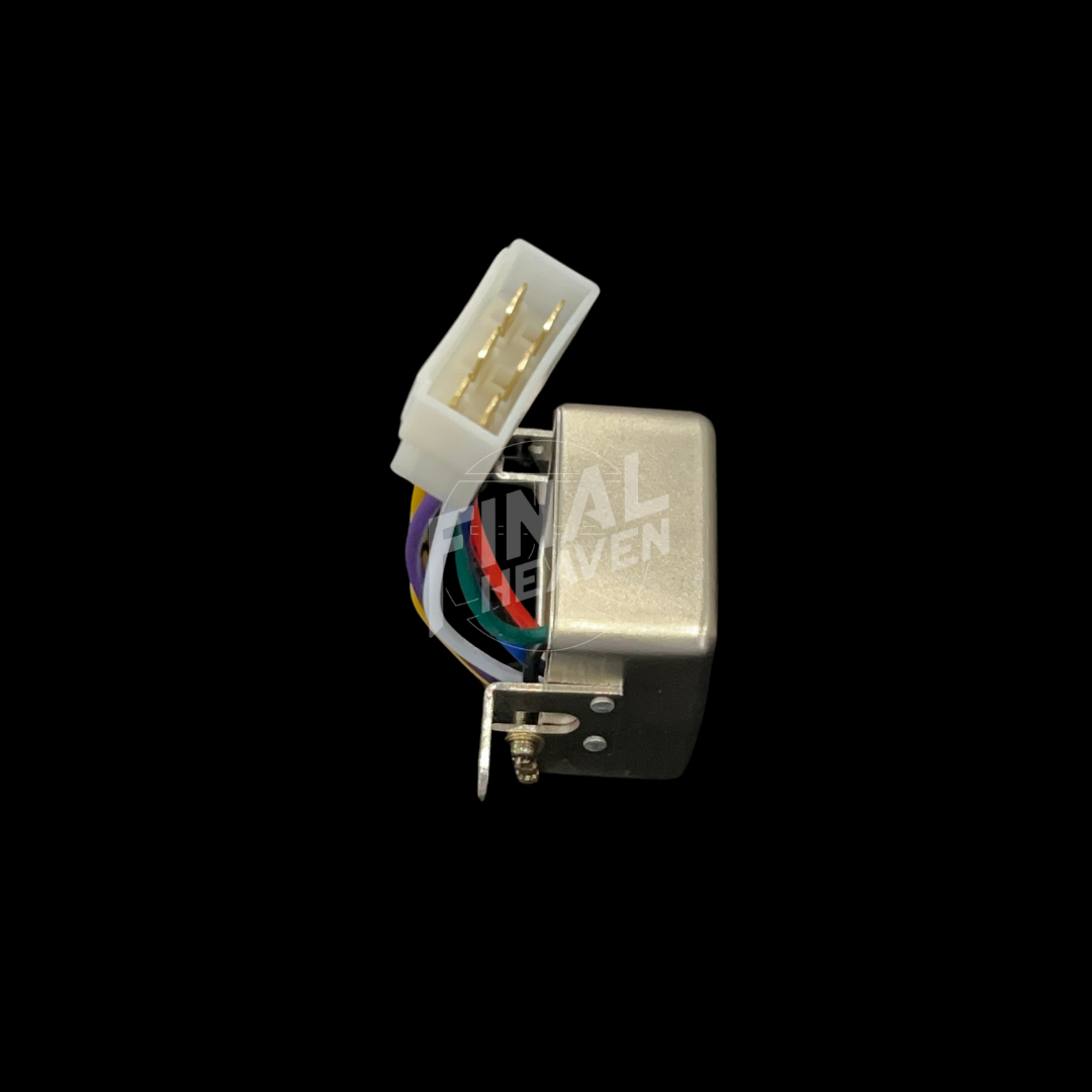 A silver headlight relay with a white connector and multicolored wires for a Nissan Skyline KGC10 or Hakosuka