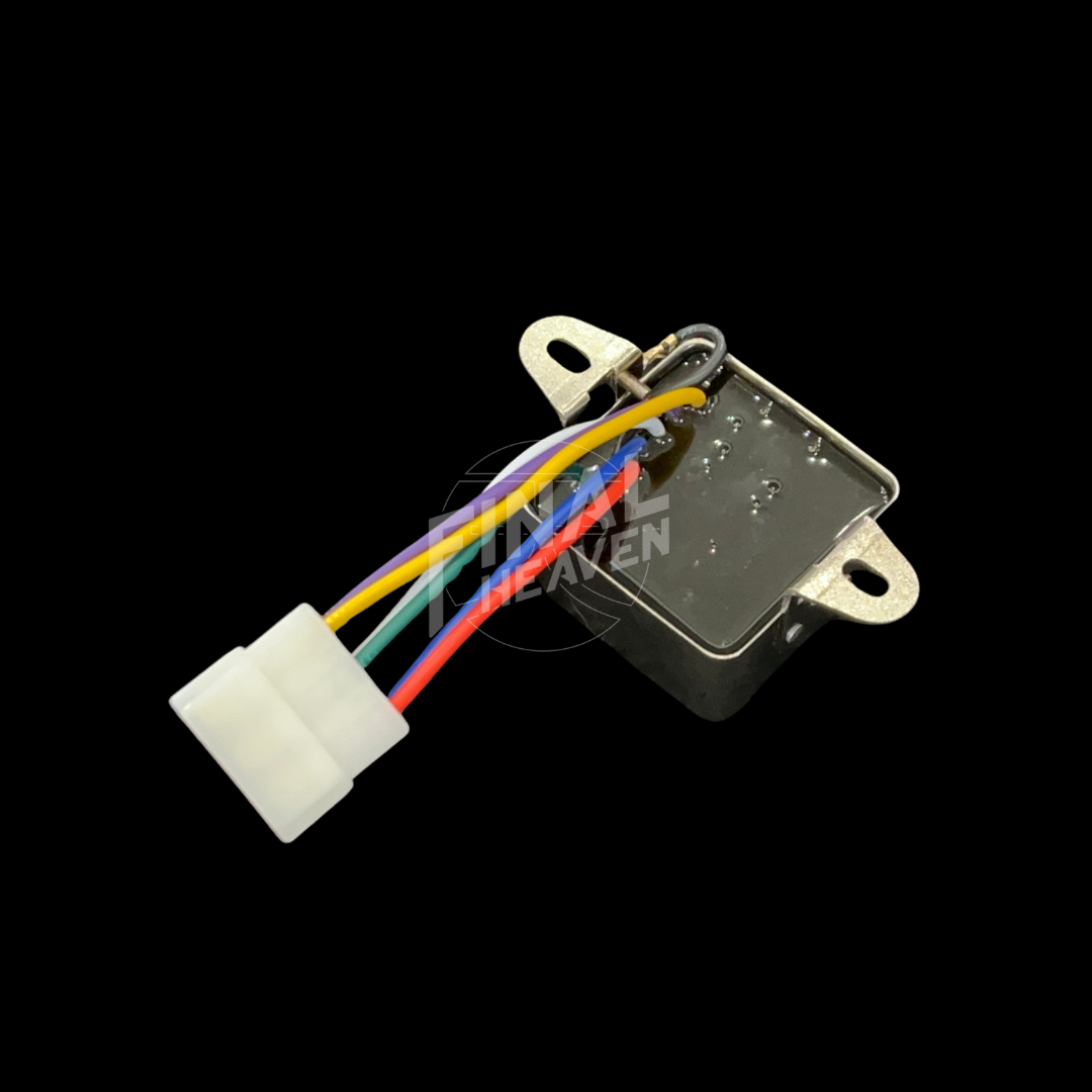 A silver headlight relay with a white connector and multicolored wires for a Nissan Skyline KGC10 or Hakosuka