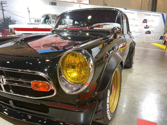 Yellow SEV Marchal Starlux installed on Chinpira Honda S600 owned by Daniel Wu