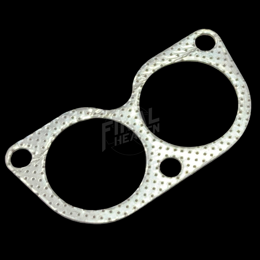 A silver engine exhaust manifold gasket for an L28 powered car such as a Nissan Skyline KGC10 Hakosuka