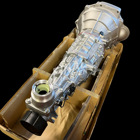 This is an ESCORT Drag Racing Service modified NISMO 6 speed cross manual transmission kit made to adapt to L28 powered Nissan Hakosuka KGC10 and Datsun 240Z 260Z or 280Z.