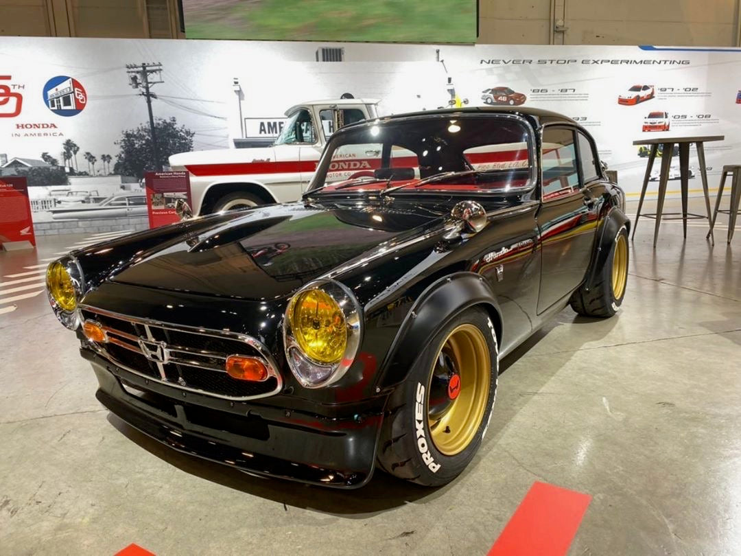 Yellow SEV Marchal Starlux installed on Chinpira Honda S600 owned by Daniel Wu at SEMA
