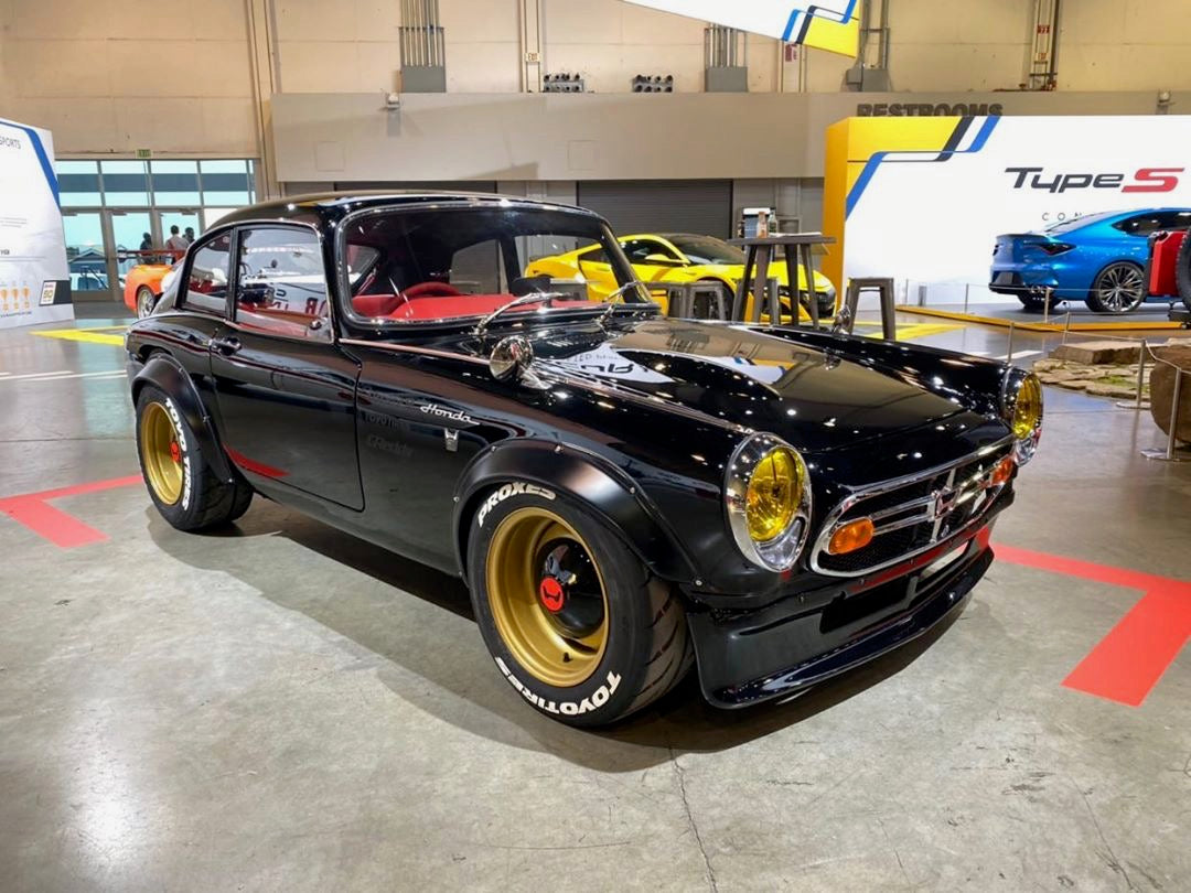 Yellow SEV Marchal Starlux installed on Black Honda S600 built by Daniel Wu