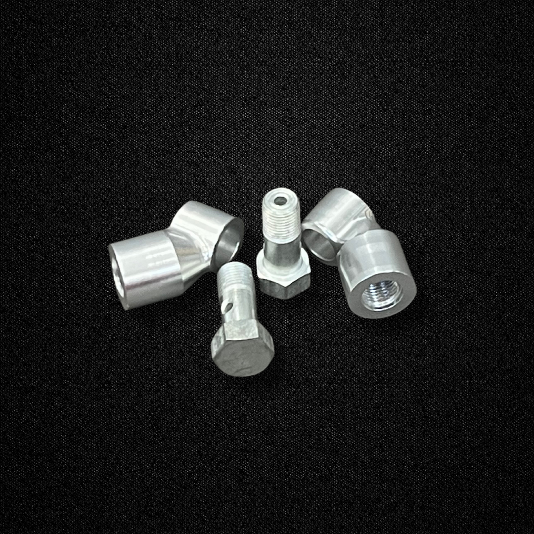 A brake banjo kit for use with Sumitomo MK63 calipers on a KGC10 Nissan Skyline 2000GT Hakosuka produced by MSpeed