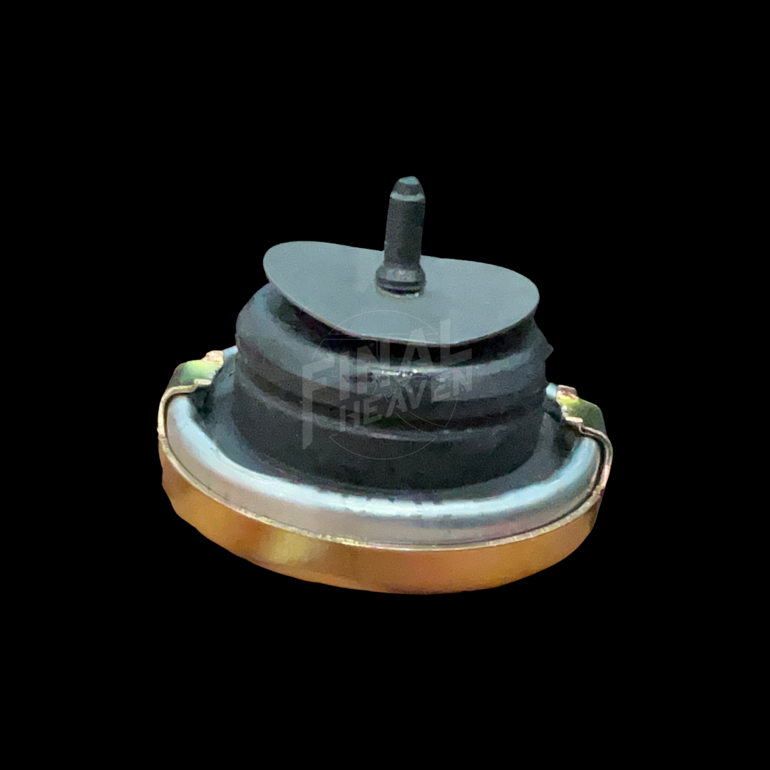 A silver-colored Tokico type cylinder cap with embossed text for Hakosuka Nissan KGC10 Skyline