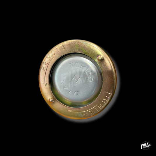 A silver-colored Tokico type cylinder cap with embossed text for Hakosuka Nissan KGC10 Skyline