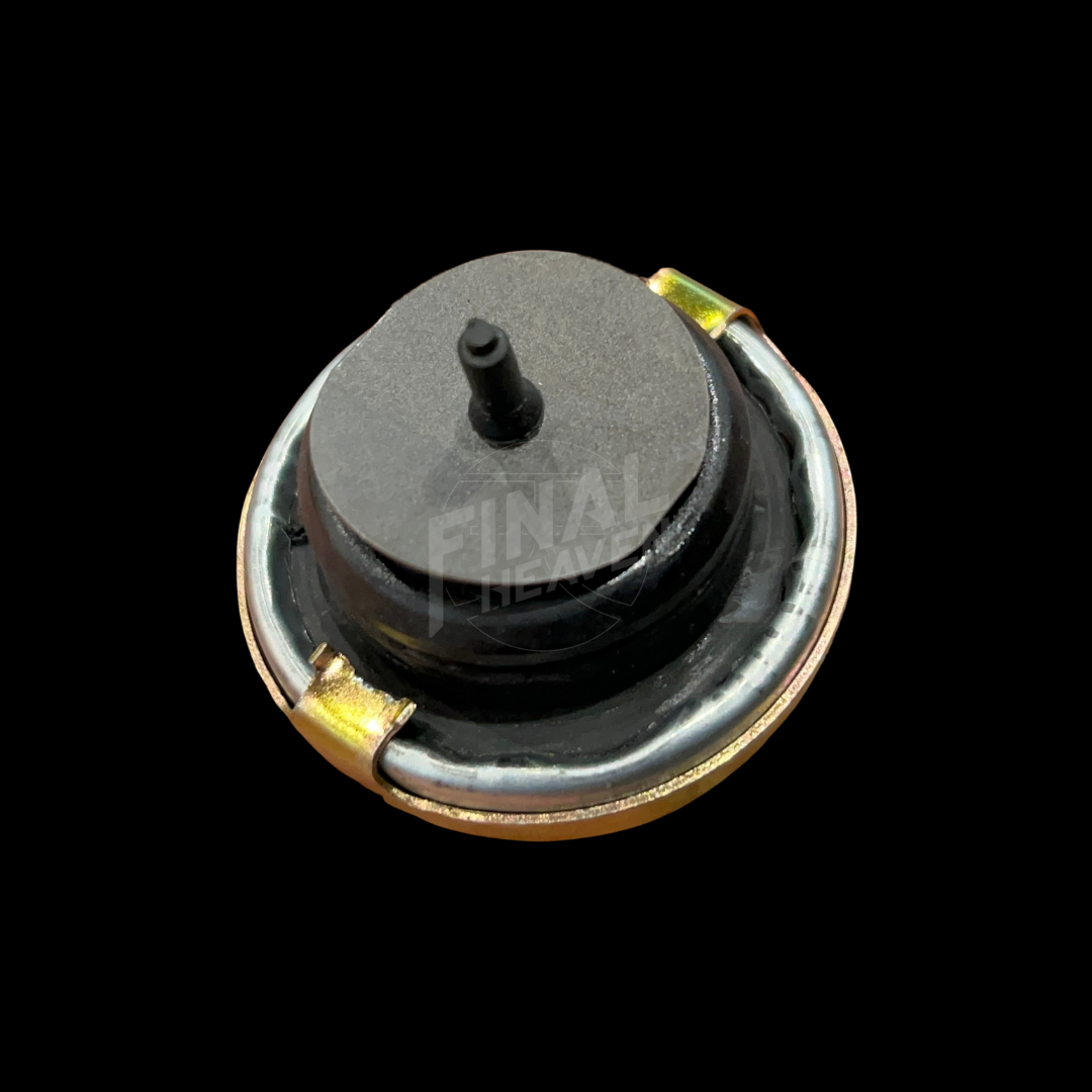 A silver-colored Tokico type cylinder cap with embossed text for Hakosuka Nissan KGC10 Skyline