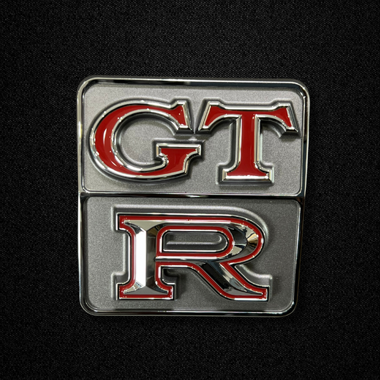 A GT-R rear emblem for a KGC10 Nissan Skyline 2000GT Hakosuka produced by MSpeed
