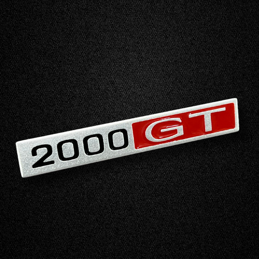 A center console emblem for a KGC10 Nissan Skyline 2000GT Hakosuka produced by MSpeed