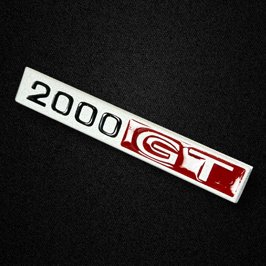 A center console emblem for a KGC10 Nissan Skyline 2000GT Hakosuka produced by MSpeed