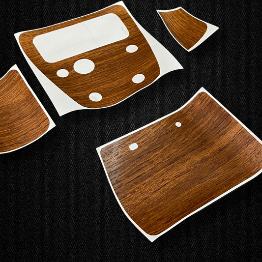 A set of center console wood pattern stickers for a KGC10 Nissan Skyline 2000GT Hakosuka produced by MSpeed