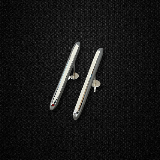 A set of rear bumper moldings for a KGC10 Nissan Skyline 2000GT Hakosuka produced by MSpeed