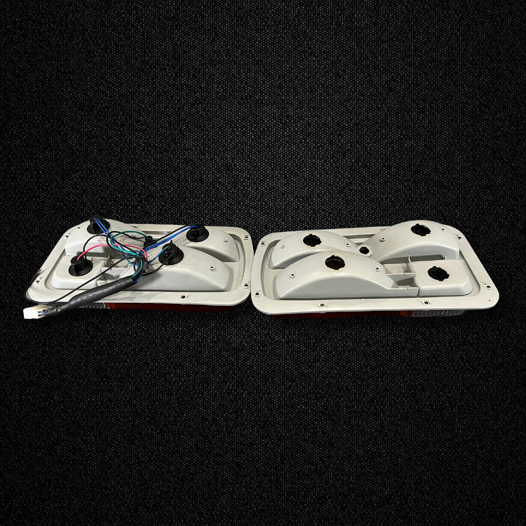 A set of half amber tail light units for a Datsun 240Z produced by MSpeed