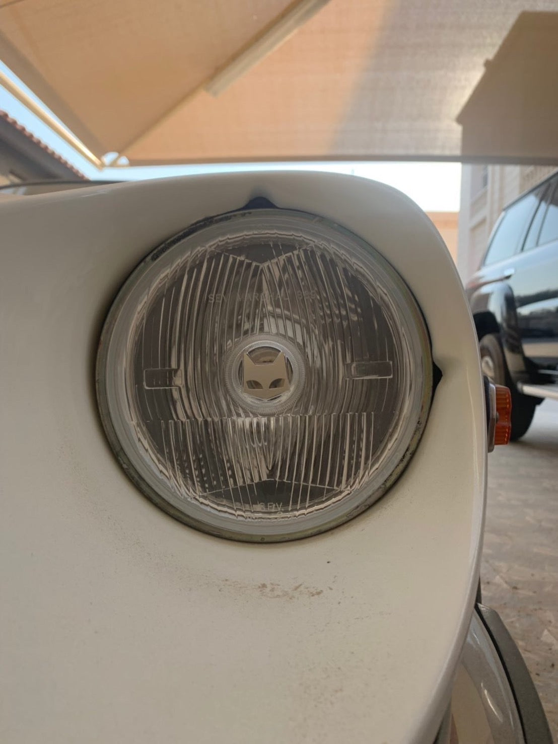 180mm clear SEV Marchal installed on a Datsun 240Z