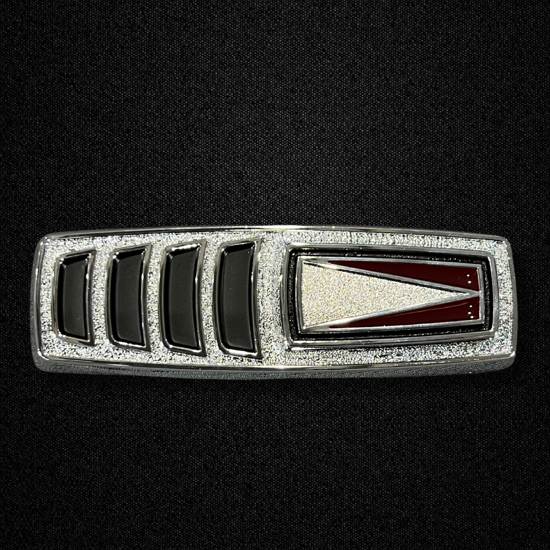 A rear fender wind cutter emblem for a KGC10 Nissan Skyline 2000GT Hakosuka produced by MSpeed
