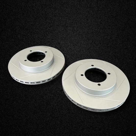 A set of 260mm ventilated brake rotors for a KGC10 Nissan Skyline 2000GT Hakosuka with Sumitomo MK63 calipers produced by MSpeed